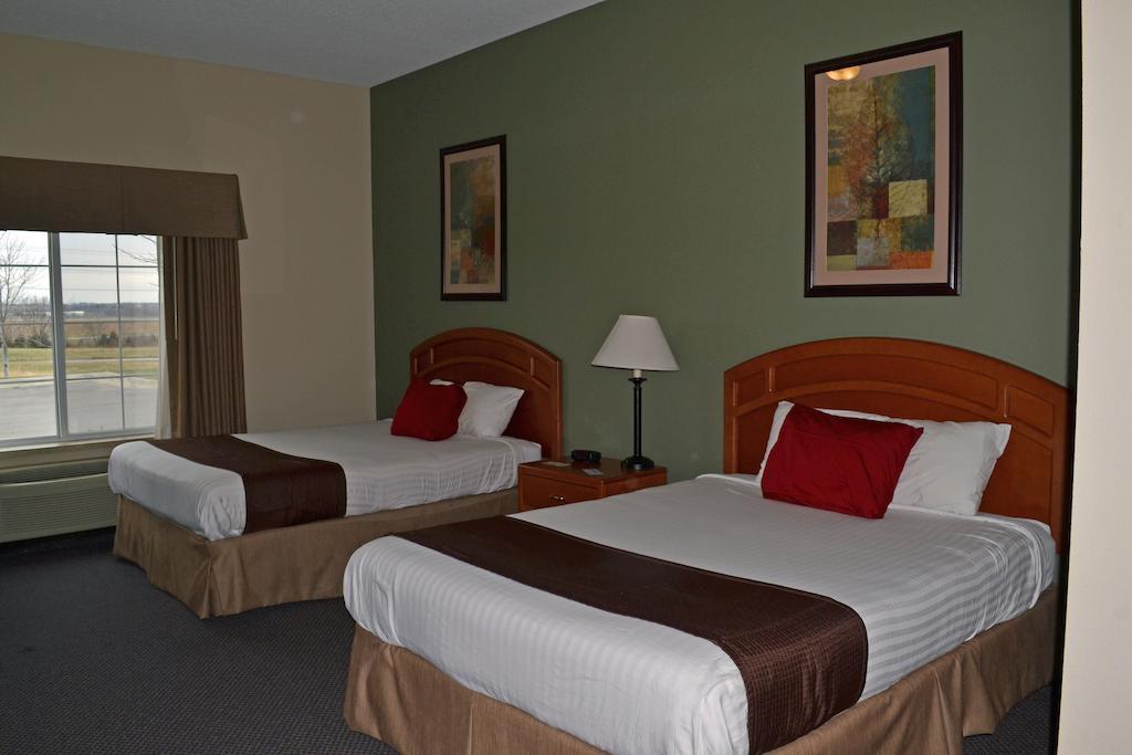 Paola Inn And Suites Habitación foto